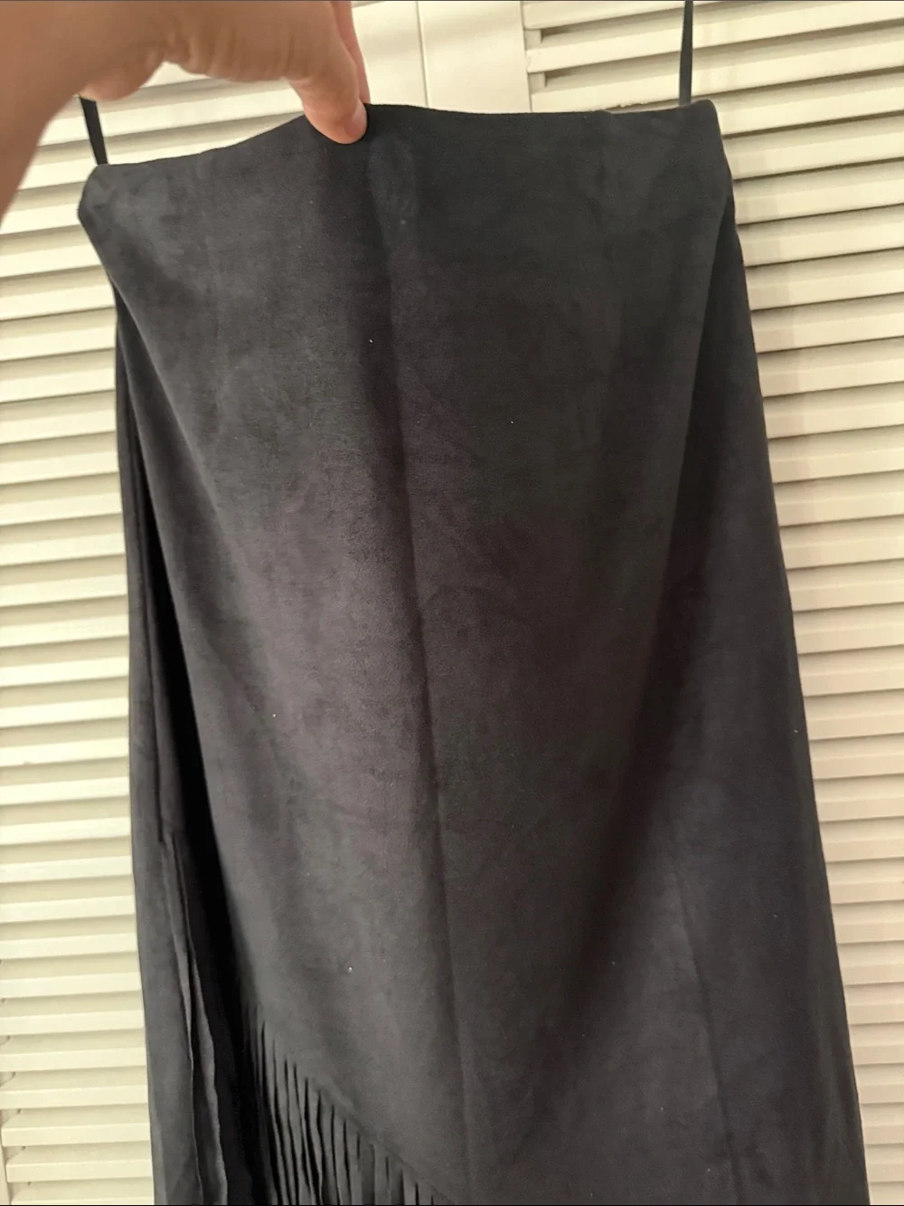 Sleek black skirt with long fringe hem. Soft suede-like texture. Hobo